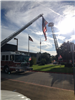 Fire Truck Ladder Hoisting an American Flag