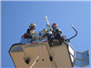 Two Fireman in a Training Tower