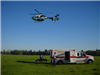 Medical Helicopter Flying Above an Ambulance