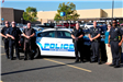 Police Staff in Front of a Police Cruiser