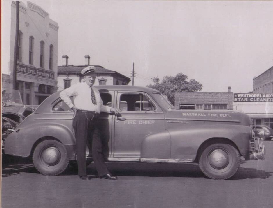 The Fire Chief Standing Beside His Vehicle